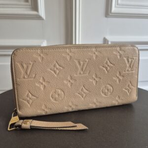 Louis Vuitton Portemonnaie empreinte Leder beige